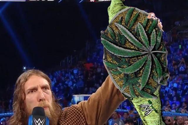 Bryan unveils “even greener” championship belt made entirely of weed