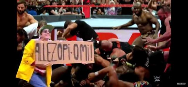 Spectator with sign causes massive 27-wrestler pileup on WWE Raw