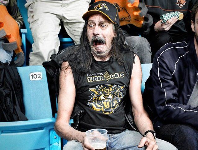 Homophobic wrestling fan suddenly realizes he’s watching oiled-up musclemen tussle