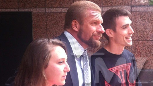Thousands of grown men chatter giddily about wrestler’s haircut