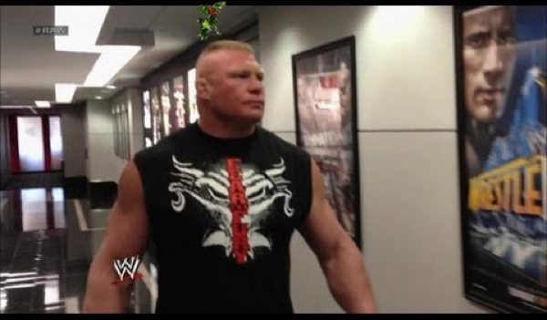 Lesnar lingers for awkwardly long time under mistletoe at WWE office Christmas party